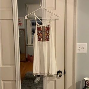 White flowy dress with patterned patch